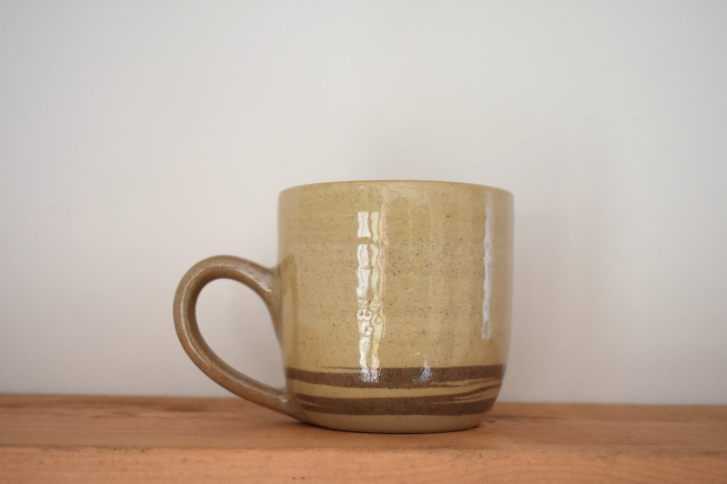Ceramics by Sunny stoneware mug with beige and brown marble pattern.