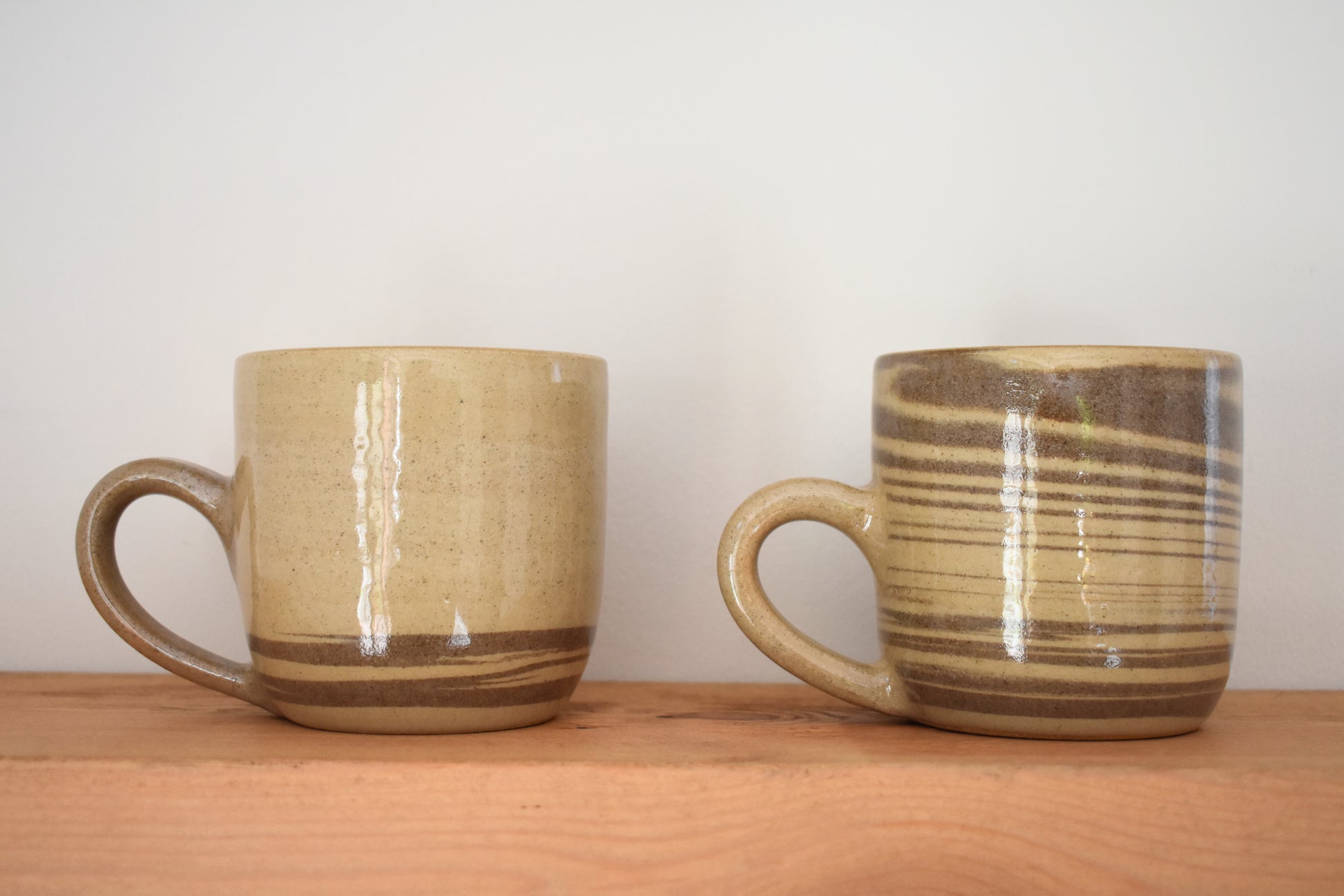 Ceramics by Sunny stoneware mugs with brown and beige marble pattern.
