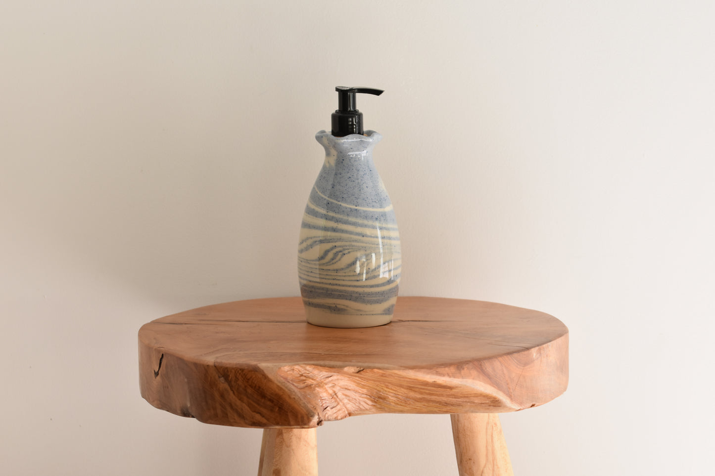 Ceramics by Sunny soap dispenser in white and speckled sky blue stoneware with black pump.