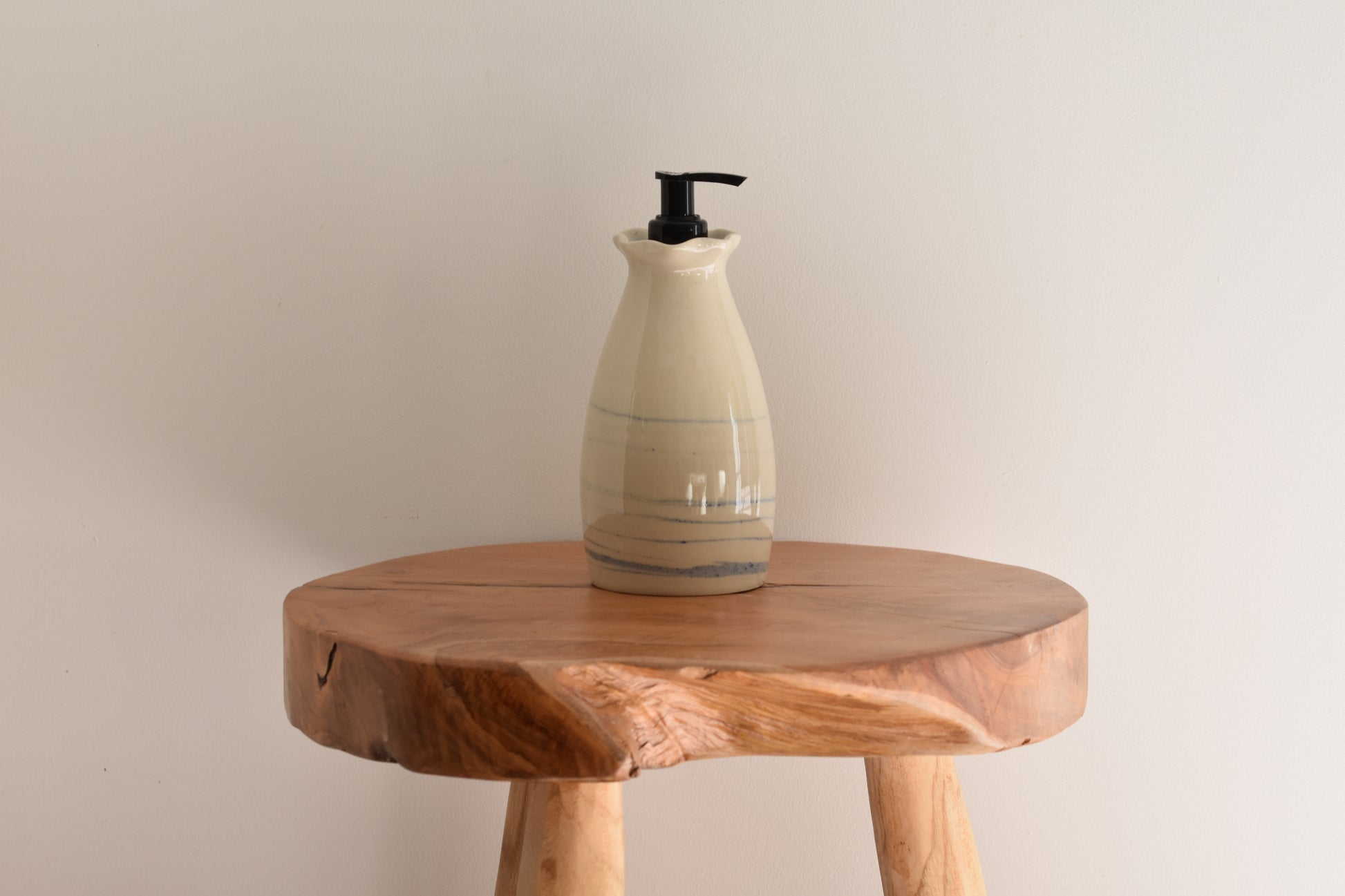 Ceramics by Sunny soap dispenser in white and speckled sky blue stoneware with black pump.