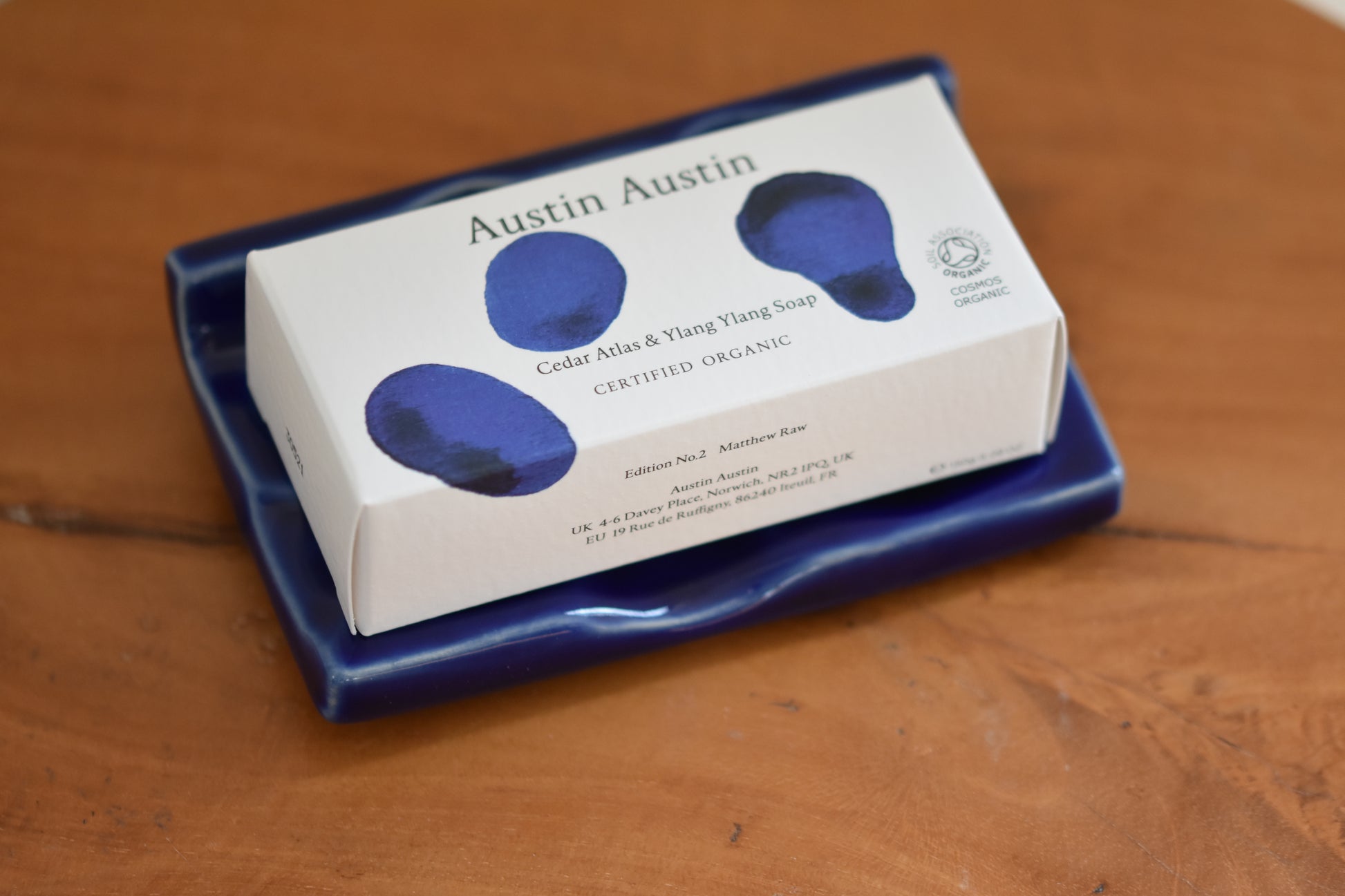 Austin Austin Organic stoneware soap dish with a high gloss cobalt blue glaze, in collaboration with ceramic artist Matthew Raw. Paired with Cedar Atlas and Ylang Ylang soap bar.