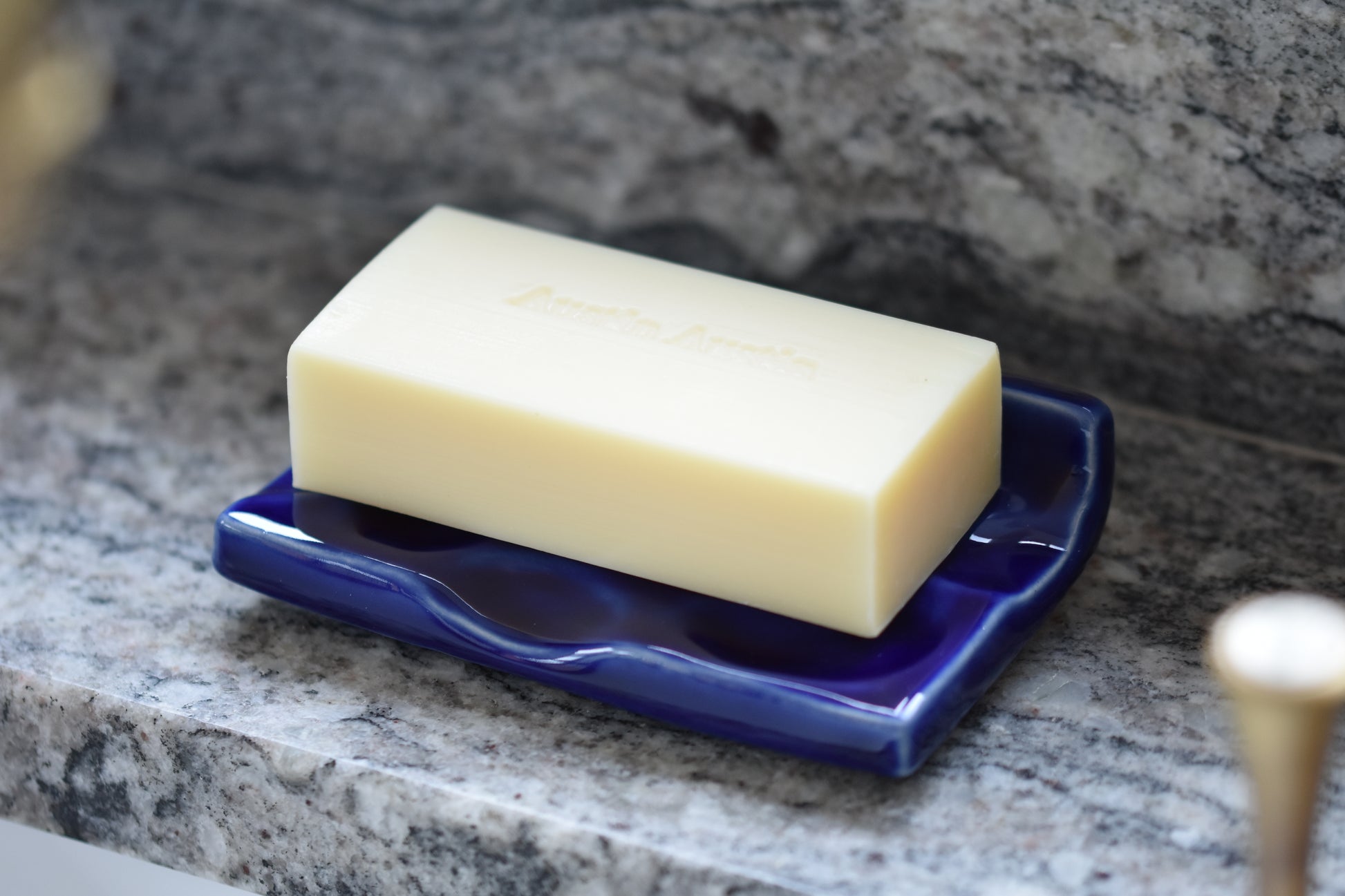 Austin Austin Organic stoneware soap dish with a high gloss cobalt blue glaze, in collaboration with ceramic artist Matthew Raw. Paired with Cedar Atlas and Ylang Ylang soap bar.
