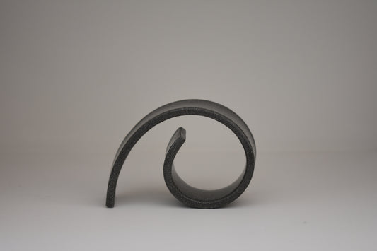 Brutes ceramics medium spiral bookend in charcoal glossy stoneware.