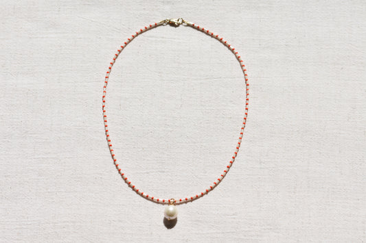 By my hands Little Baroque Necklace with stripey red and white Miyuki and Toho seed beads, small freshwater baroque pearl and gold-filled fastenings.