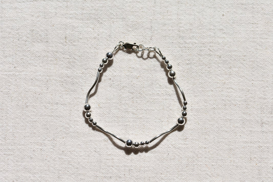 By my hands Ripple Bracelet with sterling silver wavy ripples, beads and fastening.