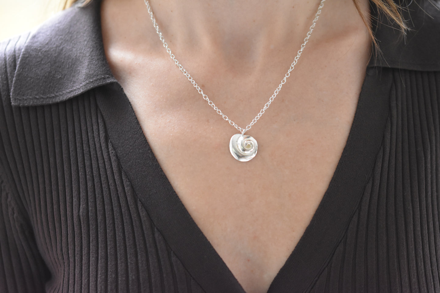 Hannah Bourn Periwinkle necklace with spiral swirl shell pendant on a chain in silver.