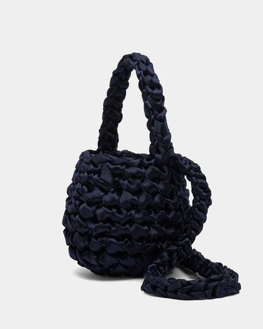 Isla de Gar dark blue navy satin ribbon crochet bag, with handle and crossbody strap on a white background.