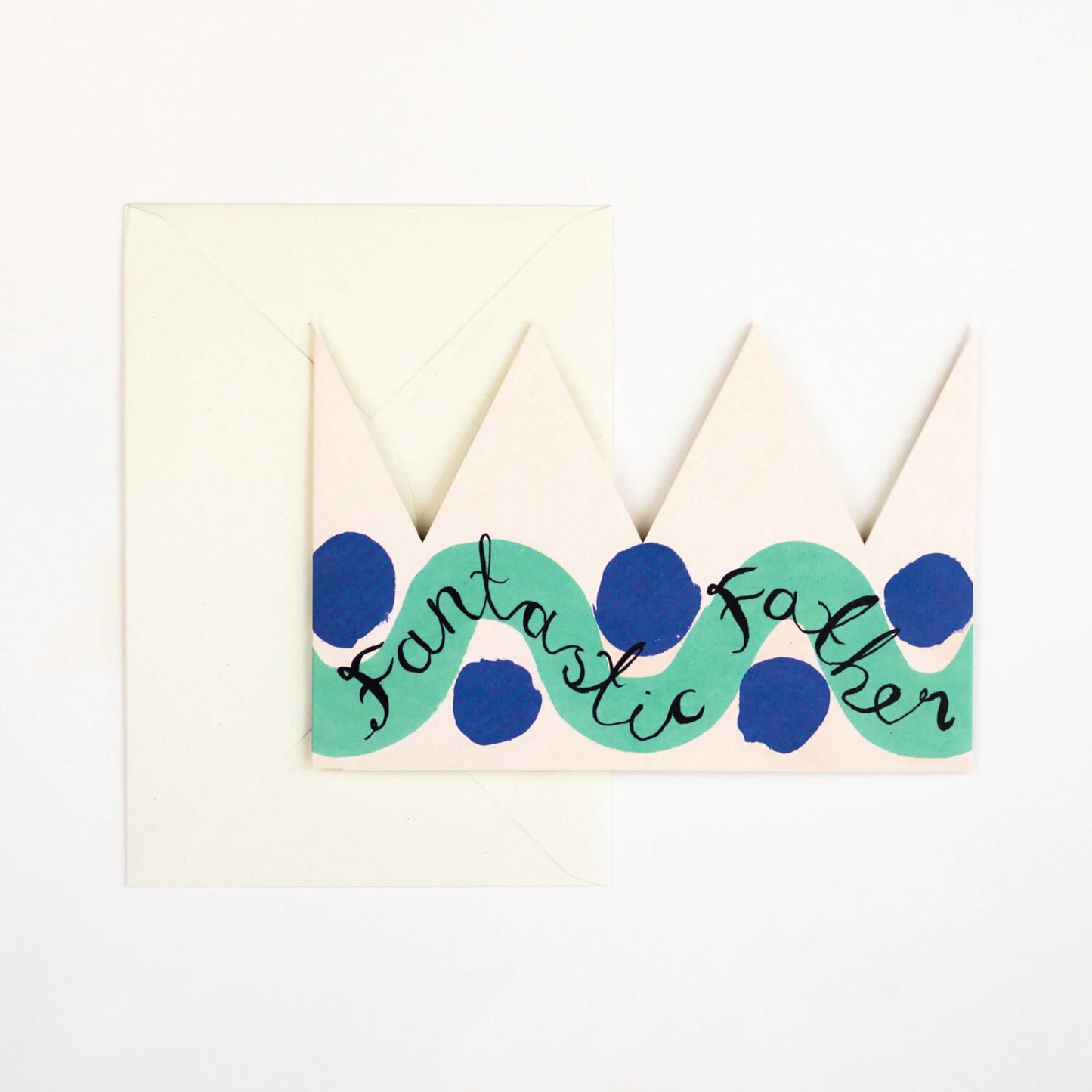 Hadley Paper Goods Fantastic Father party hat crown shaped card, with green and blue pattern, and an ivory envelope on a white background.