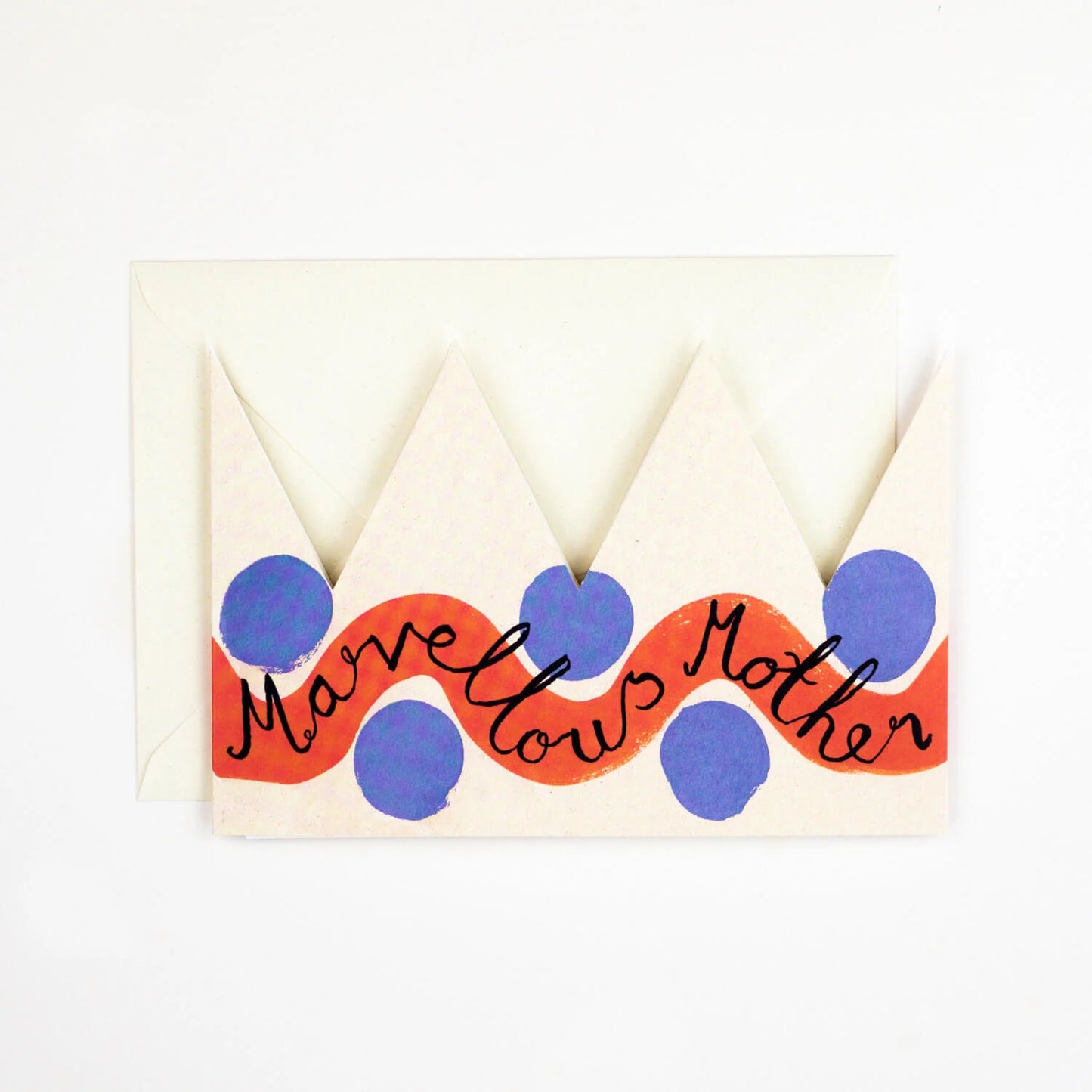 Hadley Paper Goods Marvellous Mother party hat crown shaped card with red and blue pattern and ivory envelope on a white background.