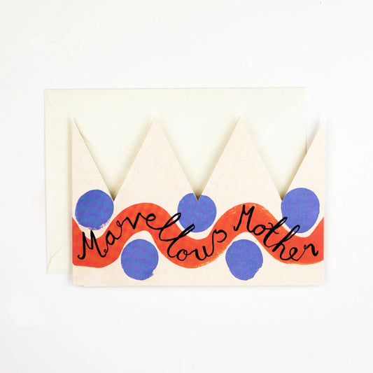 Hadley Paper Goods Marvellous Mother party hat crown shaped card with red and blue pattern and ivory envelope on a white background.