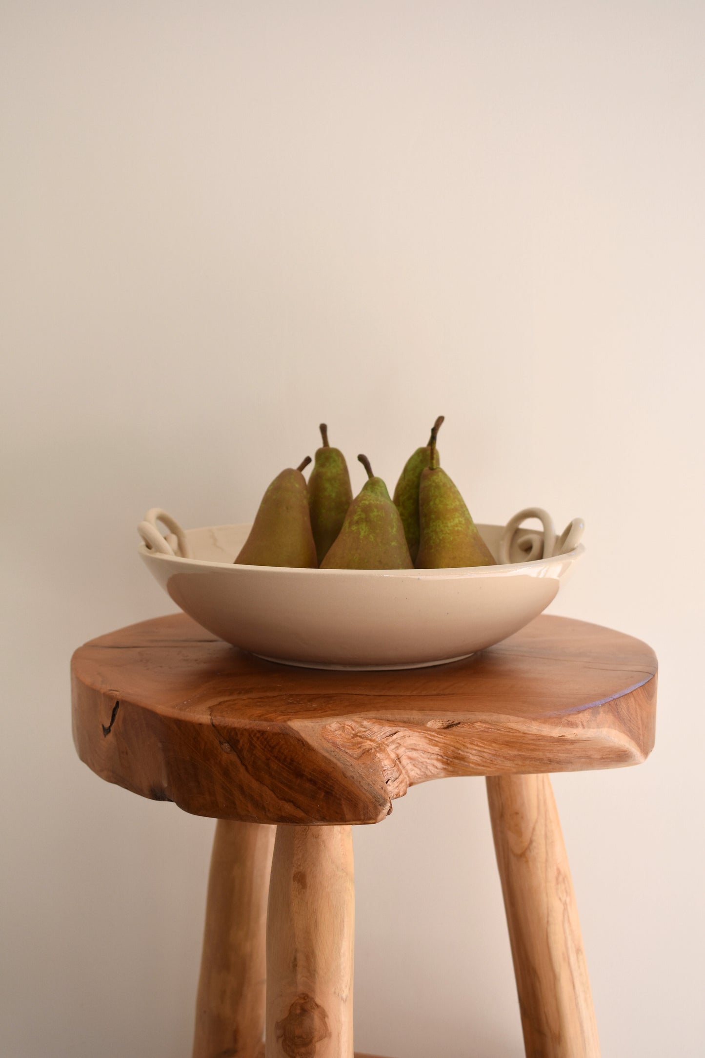 We Are Clay Pretzel fruit bowl in white ceramic with spiral design.