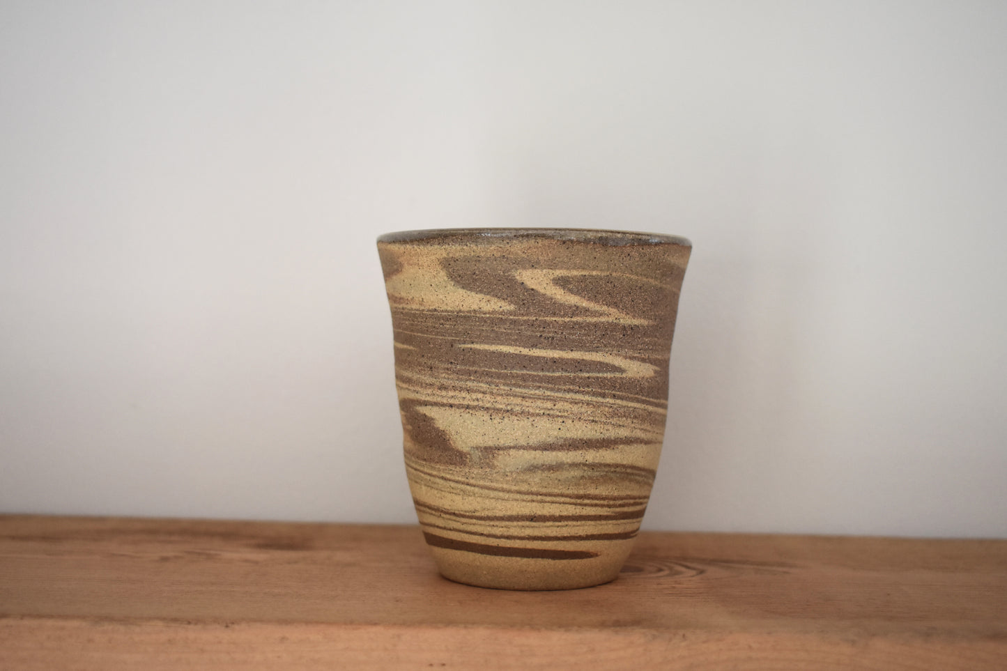 Ceramics by Sunny stoneware spiral cup with brown and beige marble pattern.