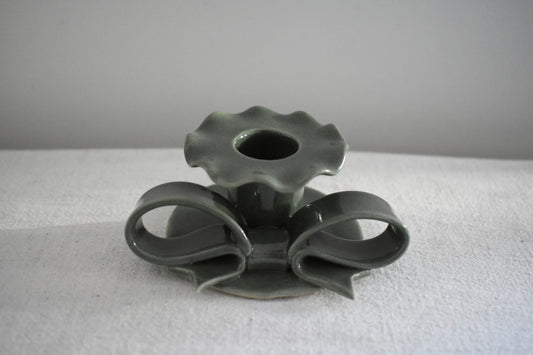 Superfluities stoneware ceramic Bow Candlestick with frill in green.