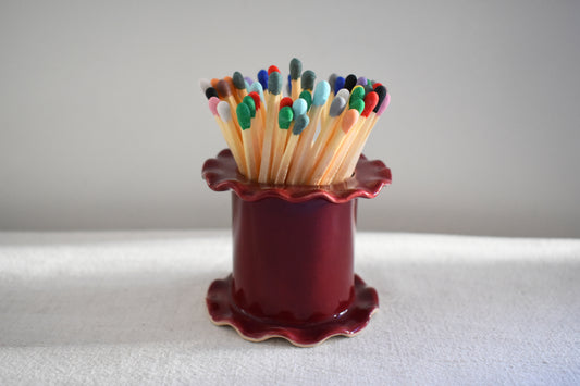 Superfluities stoneware ceramic frilled Matchstick Holder pot in burgundy with multicolour matches.