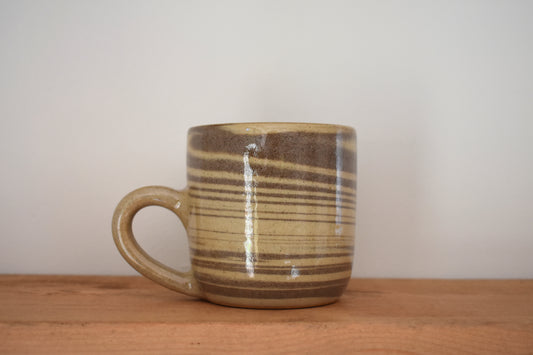 Ceramics by Sunny stoneware mug with brown and beige marble pattern.