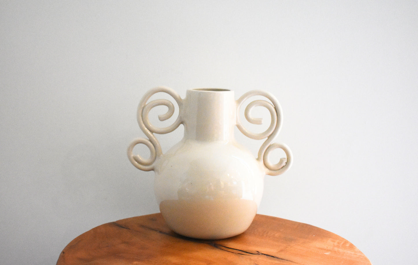 We Are Clay Curly Sue Vase in white ceramic with spiral handles.