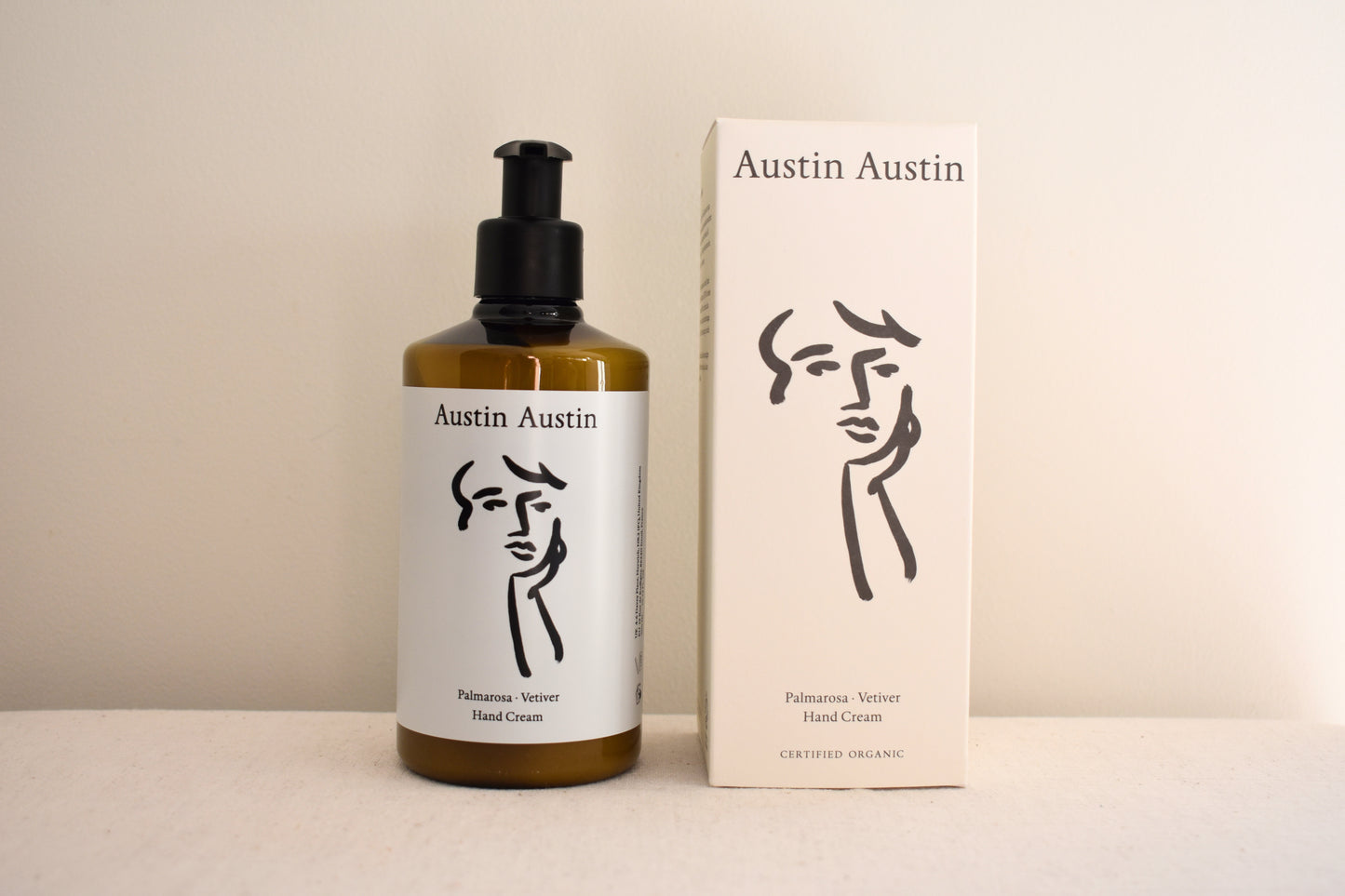 Austin Austin Organic hand cream with face outline artwork on the bottle and box.