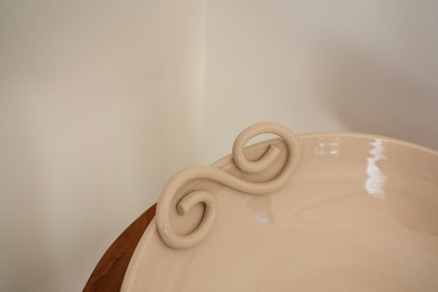 We Are Clay Pretzel fruit bowl in white ceramic with spiral design.