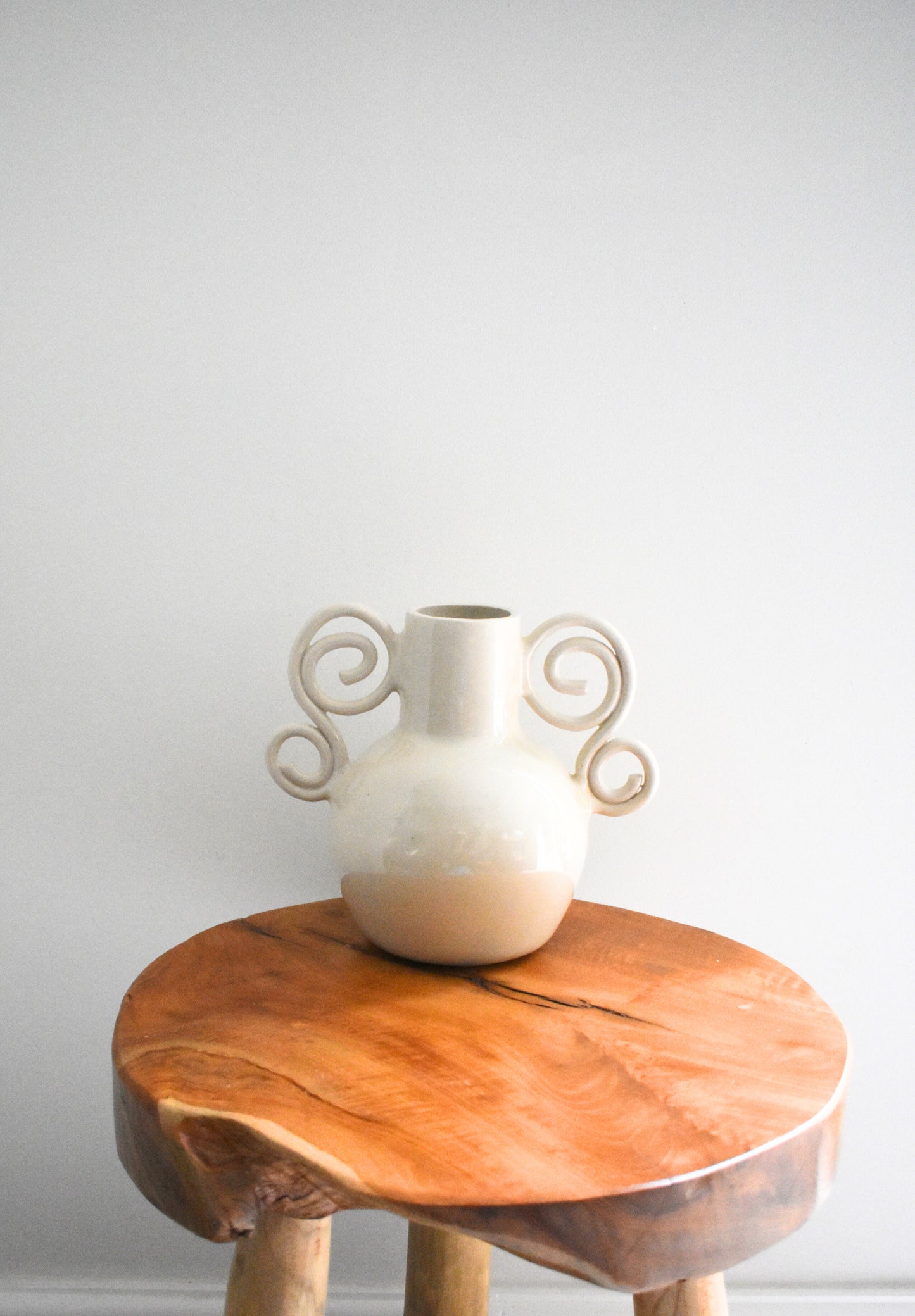 We Are Clay Curly Sue Vase in white ceramic with spiral handles.