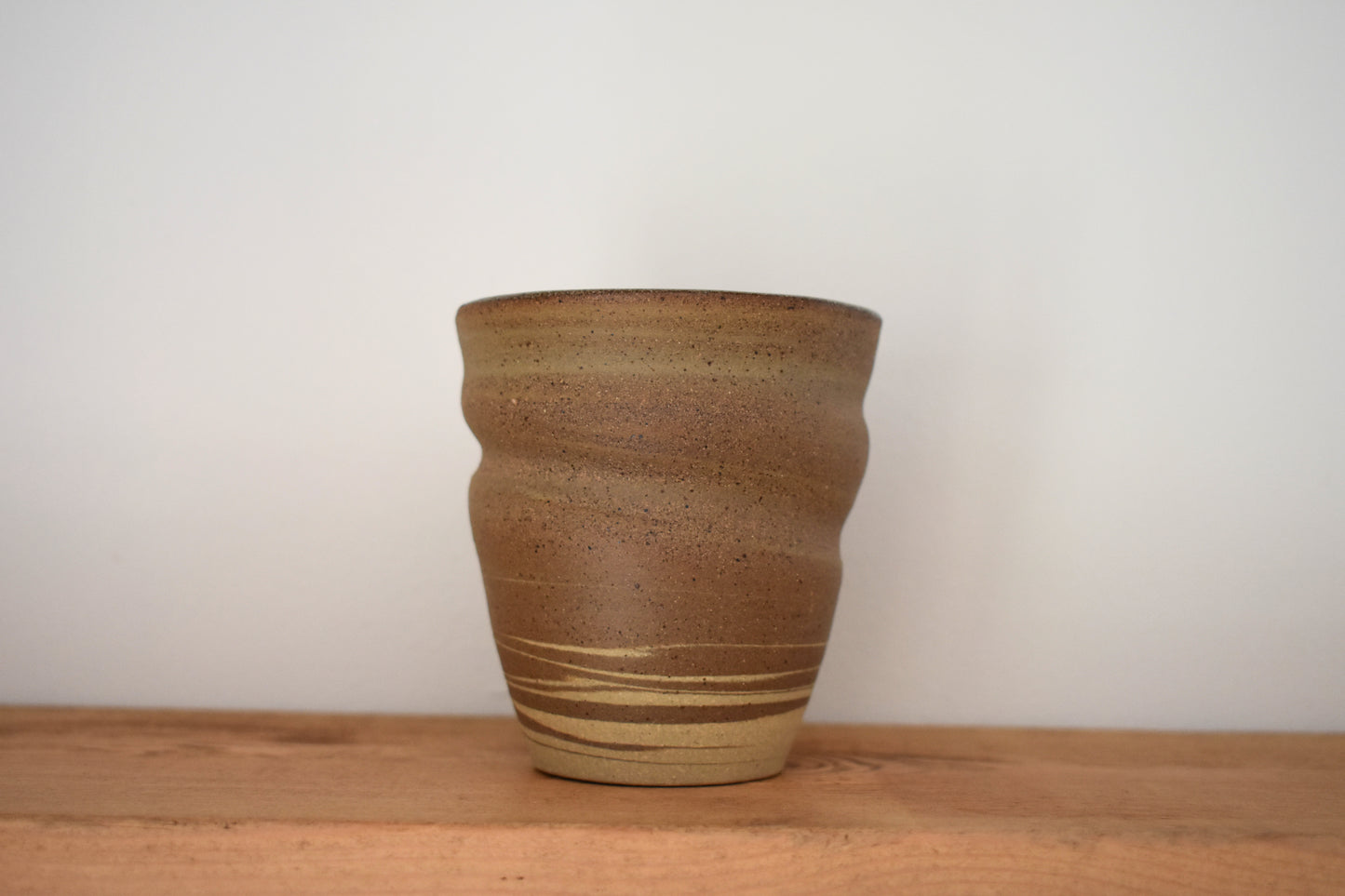 Ceramics by Sunny stoneware spiral cup with brown and beige marble pattern.