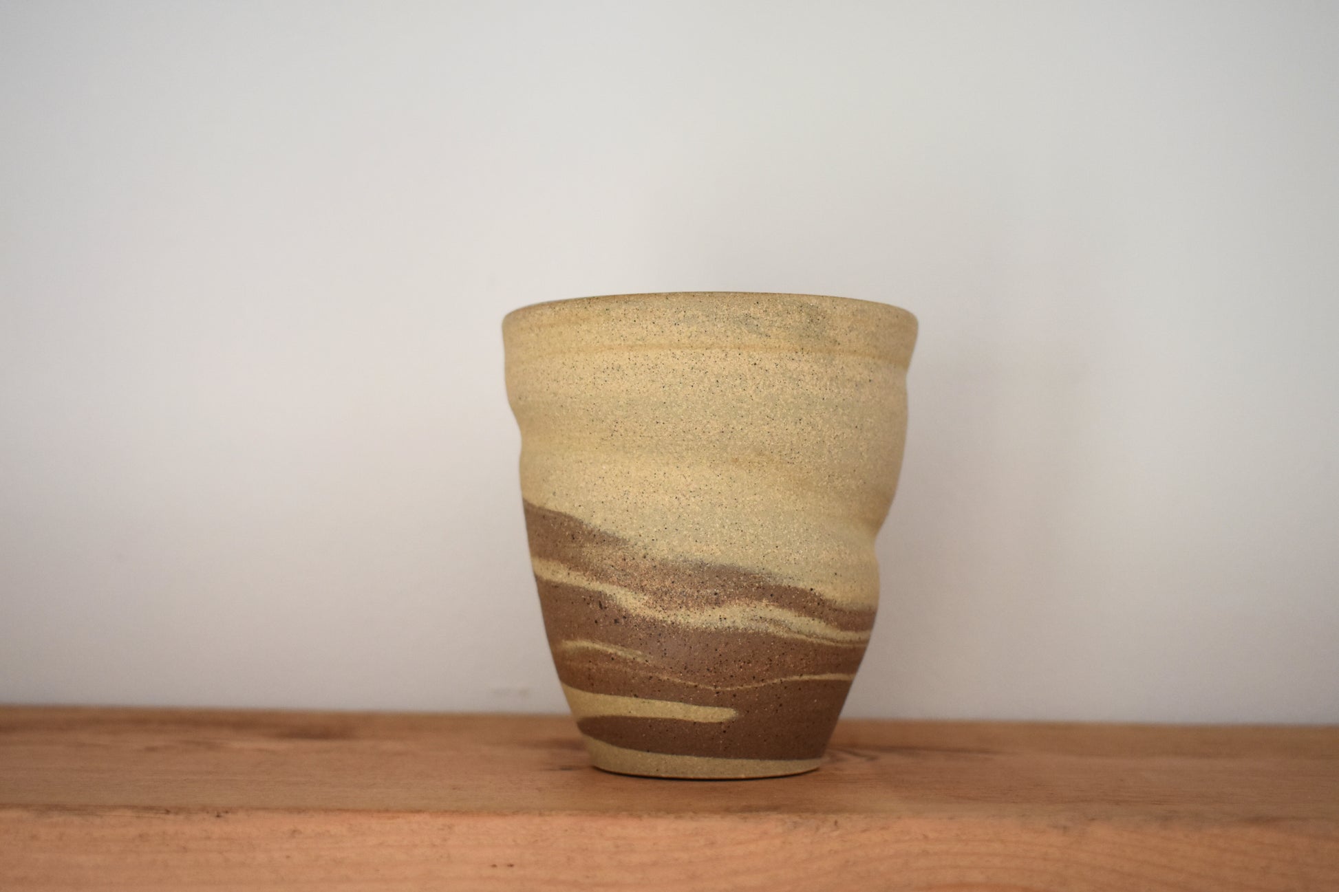 Ceramics by Sunny stoneware spiral cup with beige and brown marble pattern. 