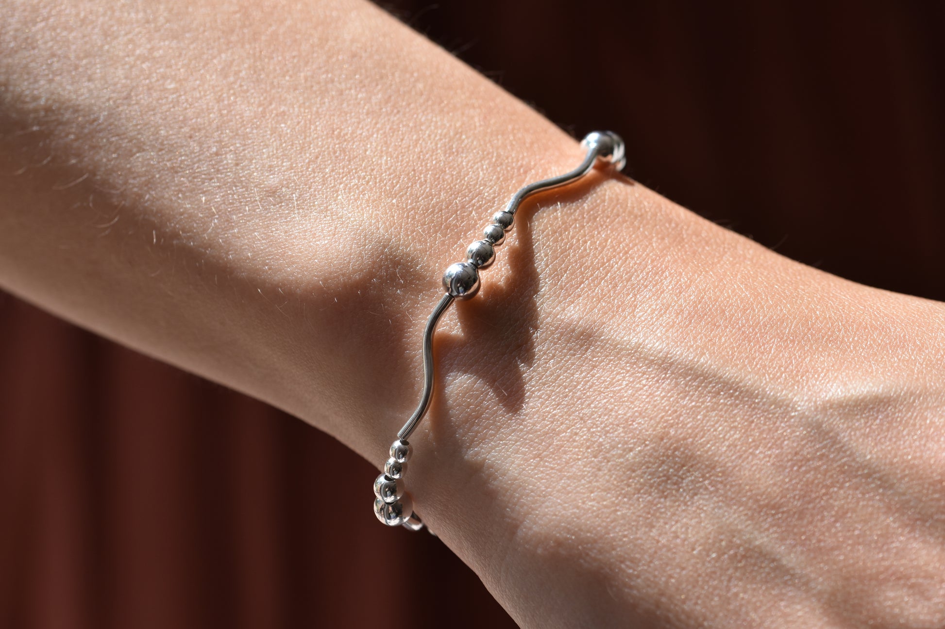 By my hands Ripple Bracelet with sterling silver wavy ripples, beads and fastening.