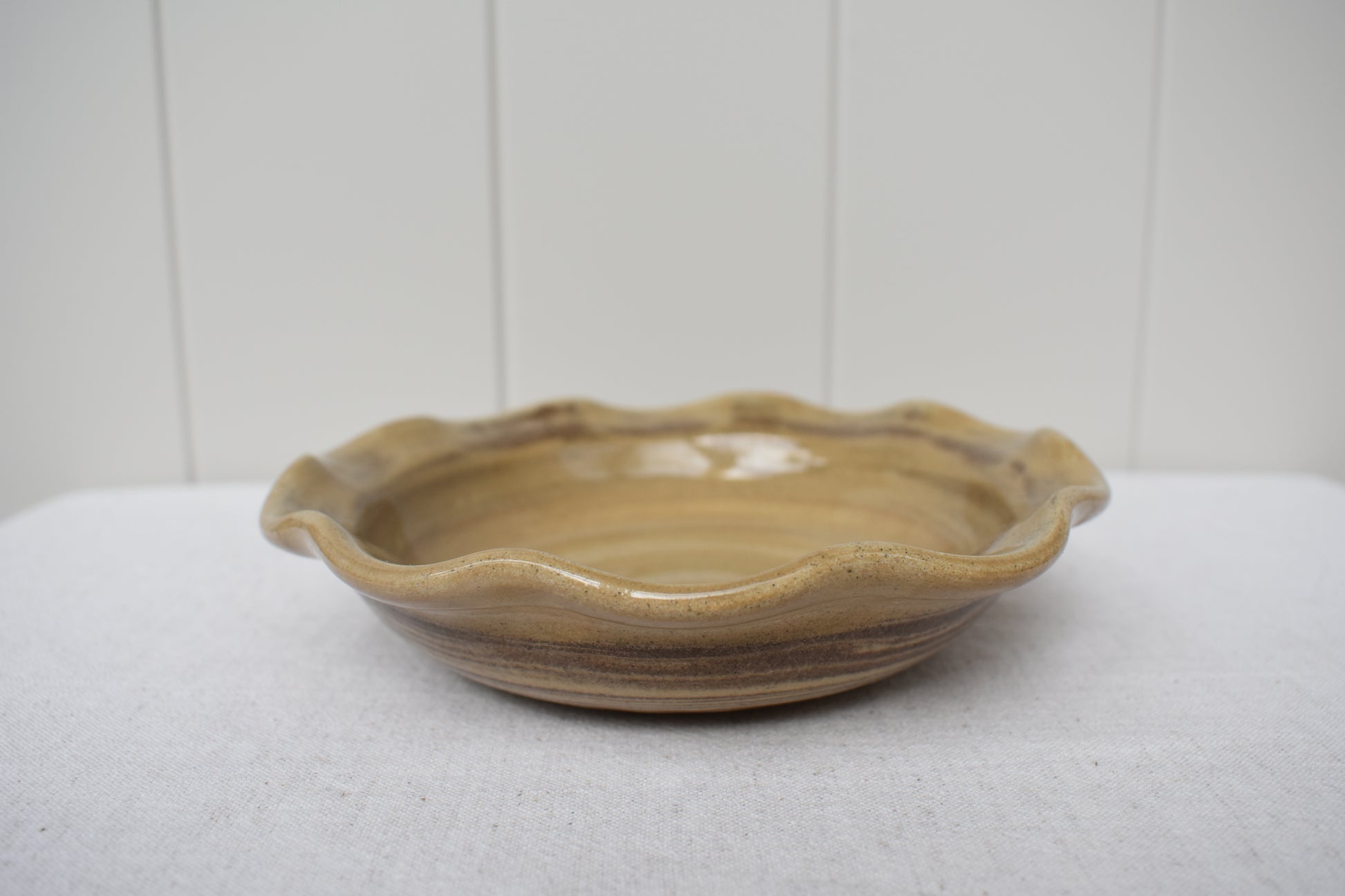 Ceramics by Sunny stoneware wavy frilled edge small bowl with brown and beige marble pattern.