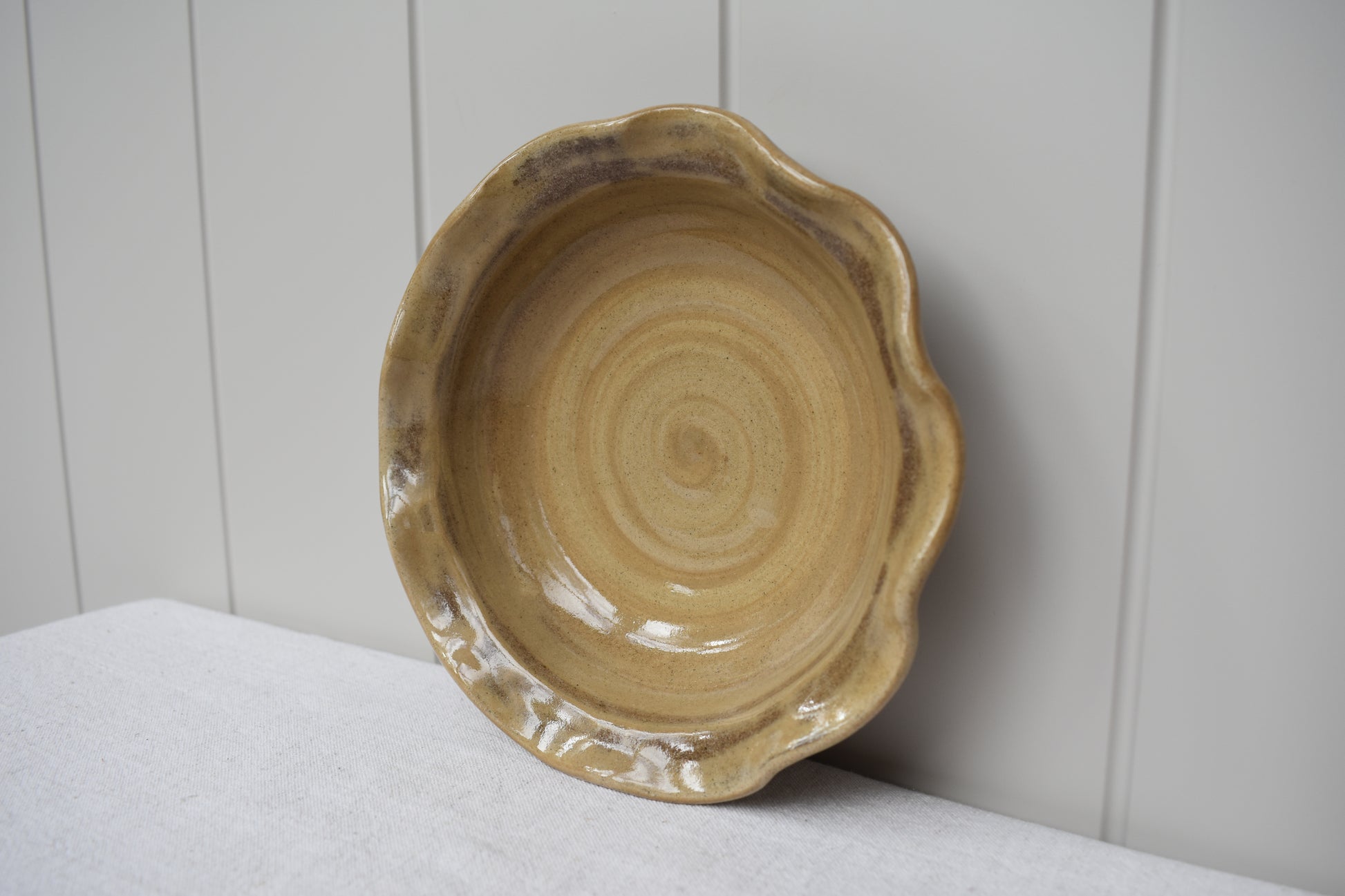 Ceramics by Sunny stoneware wavy frilled edge small bowl with brown and beige marble pattern.