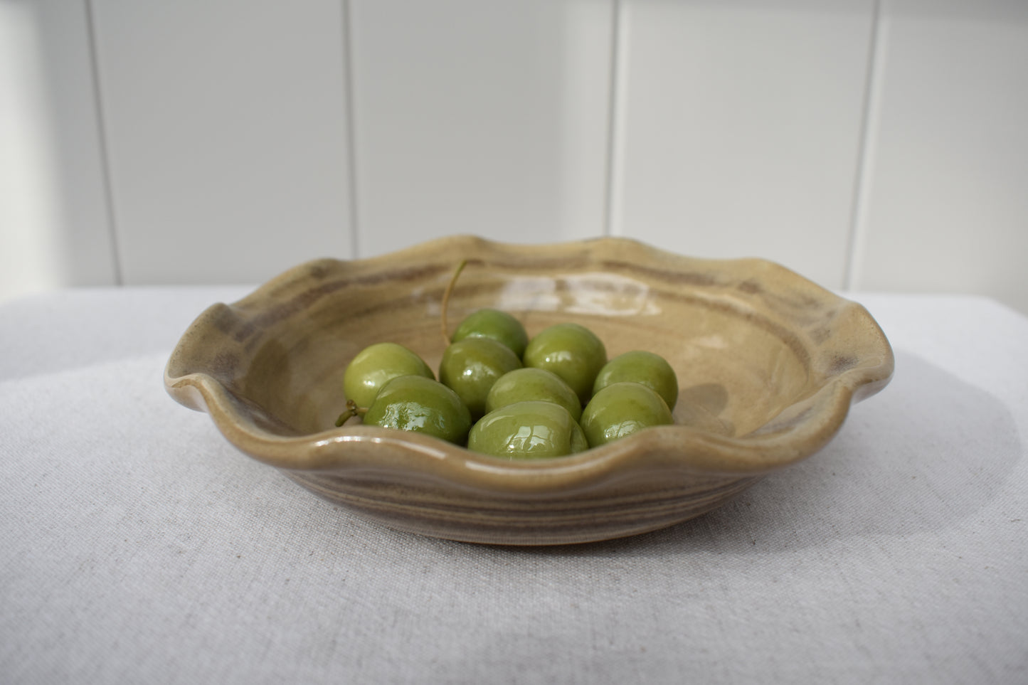 Ceramics by Sunny stoneware wavy frilled edge small bowl with brown and beige marble pattern.