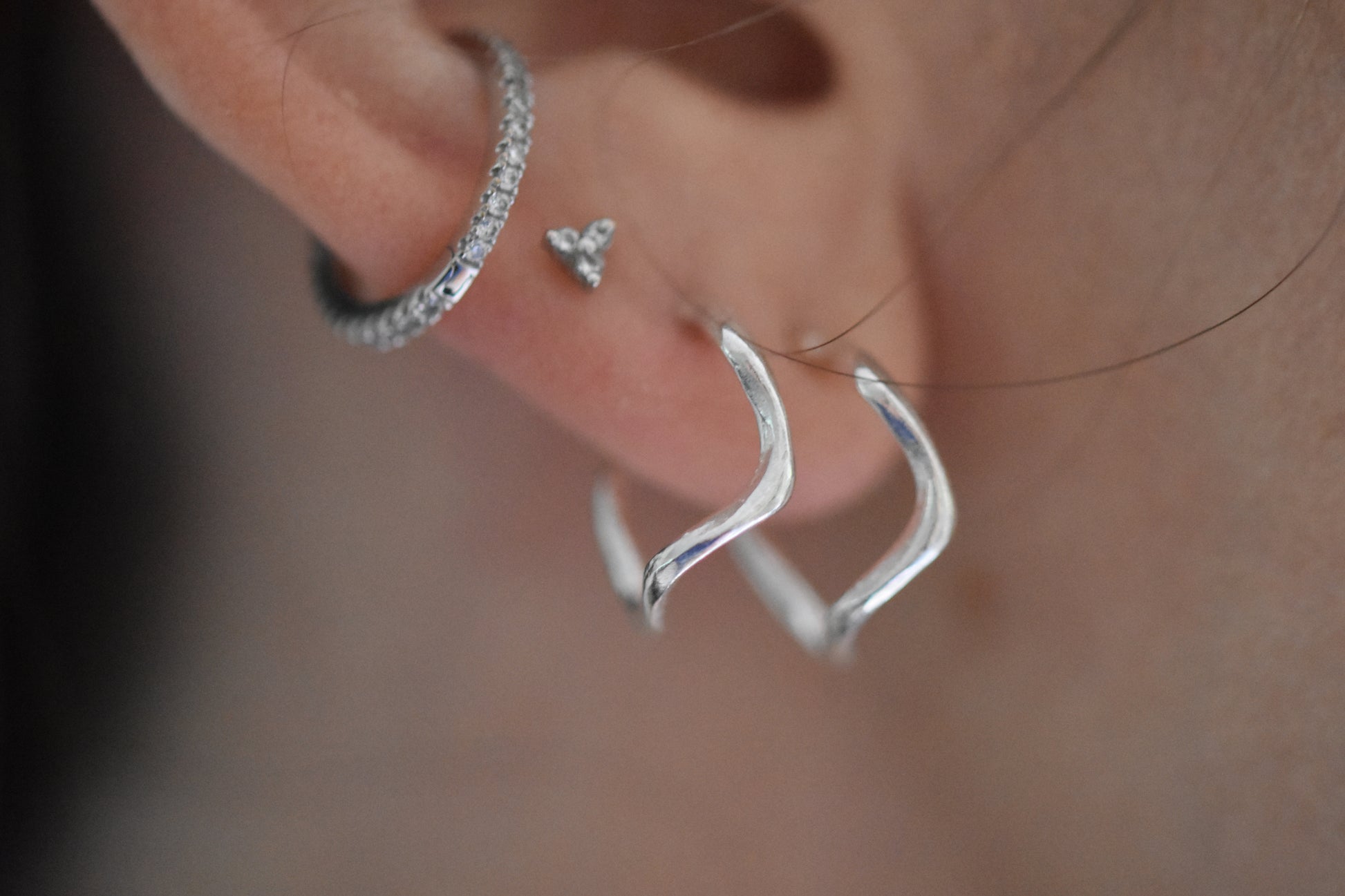 Hannah Bourn Mini Saccostrea wavy hoops in silver.