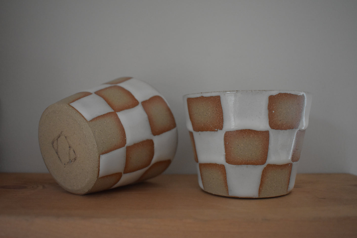 AEA Studio ceramic stoneware cups with white chequer pattern.