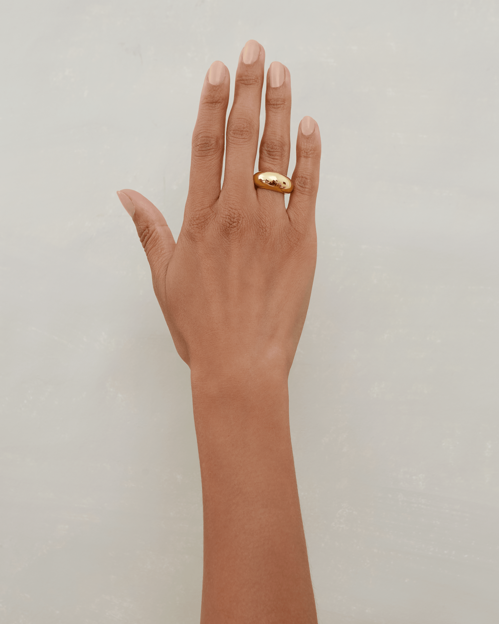 Daphine Oli chunky domed ring in gold.