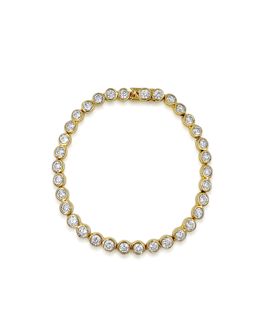 Daphine Chris gold tennis bracelet with cubic zirconia.