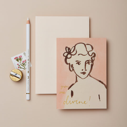 Wanderlust Paper Co you are divine card in pink with painted portrait design.