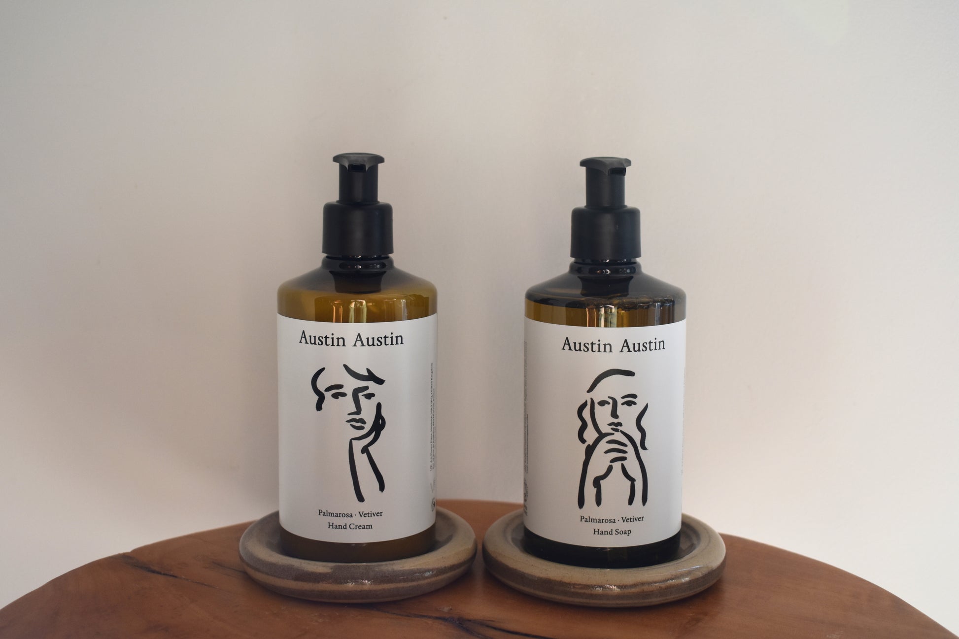 Austin Austin Organic hand cream and hand soap with face outline artwork on the bottles.