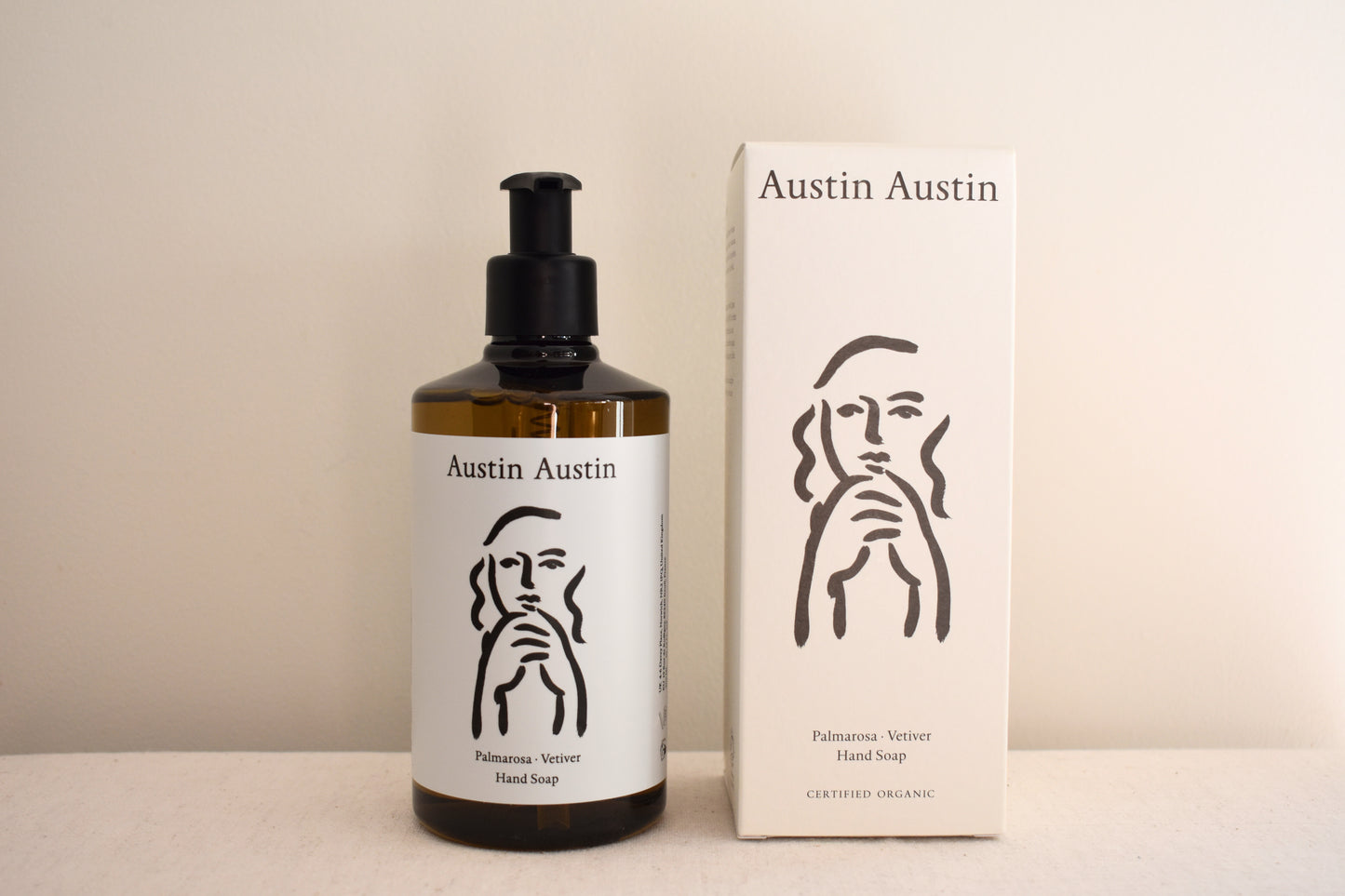 Austin Austin Organic hand soap with face outline artwork on the bottle and box.