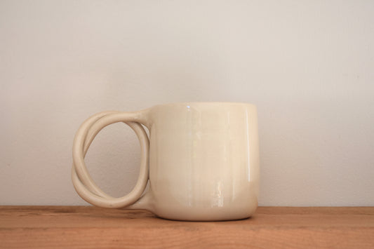 We Are Clay white ceramic Pretzel Mug with twisted pretzel handle.