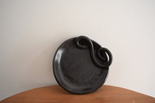 We Are Clay Wee Dish in black ceramic with spiral design.