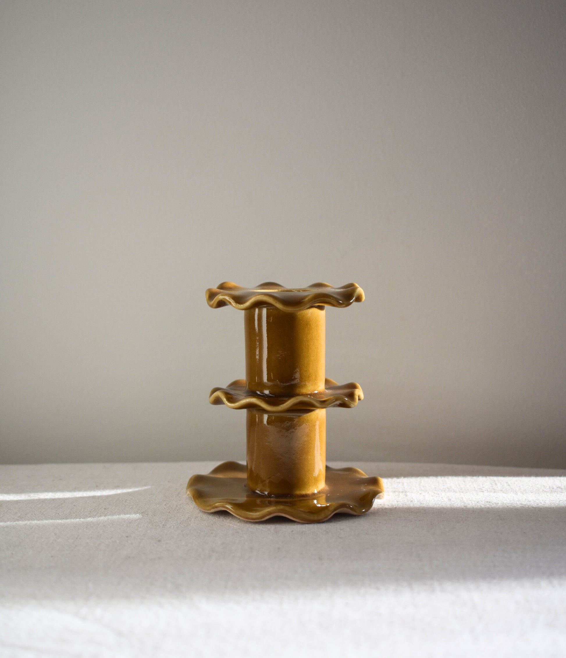 Superfluities stoneware ceramic Medium Frill Candlestick in honey ochre yellow.